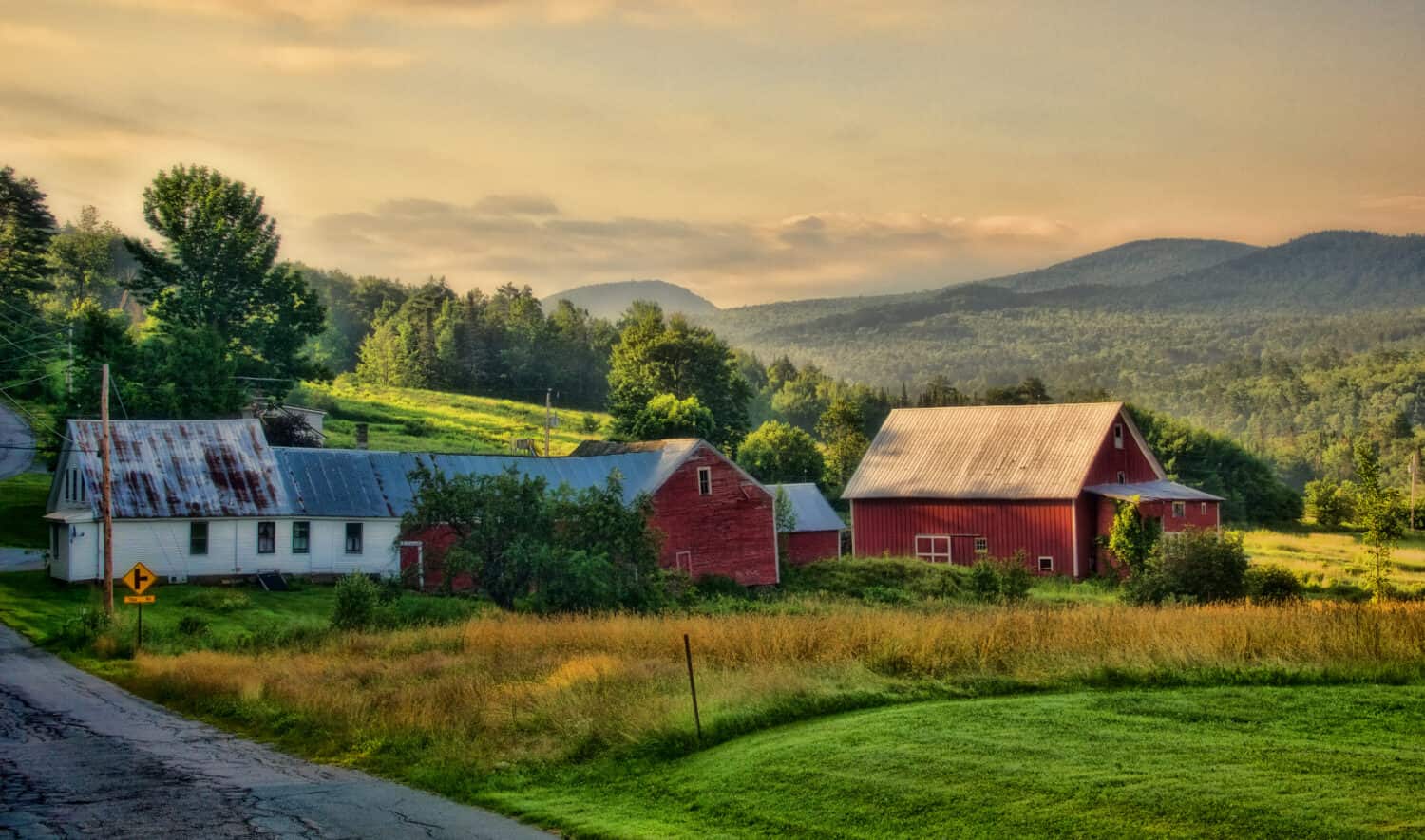 First light of the day slowly warming up the farm early summer morning. Landaff, NH