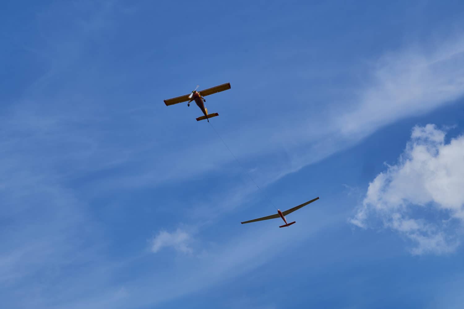 two aircraft flying in the blue sky.