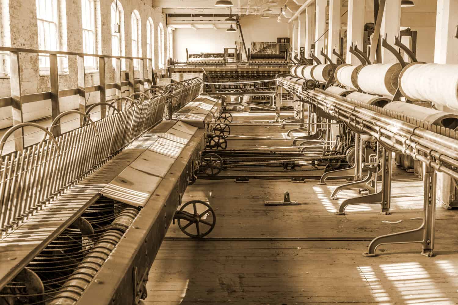 Old 1900s Woolen Mill Machinery and Manufacturing in Sepia Tone.