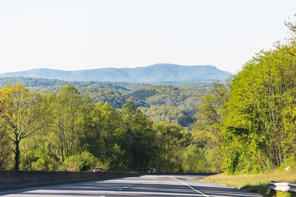 Stock Photo ID: 1212581008 Smoky Mountains near Asheville, North Carolina at Tennessee border during sunny spring day, sky, green trees, highway road