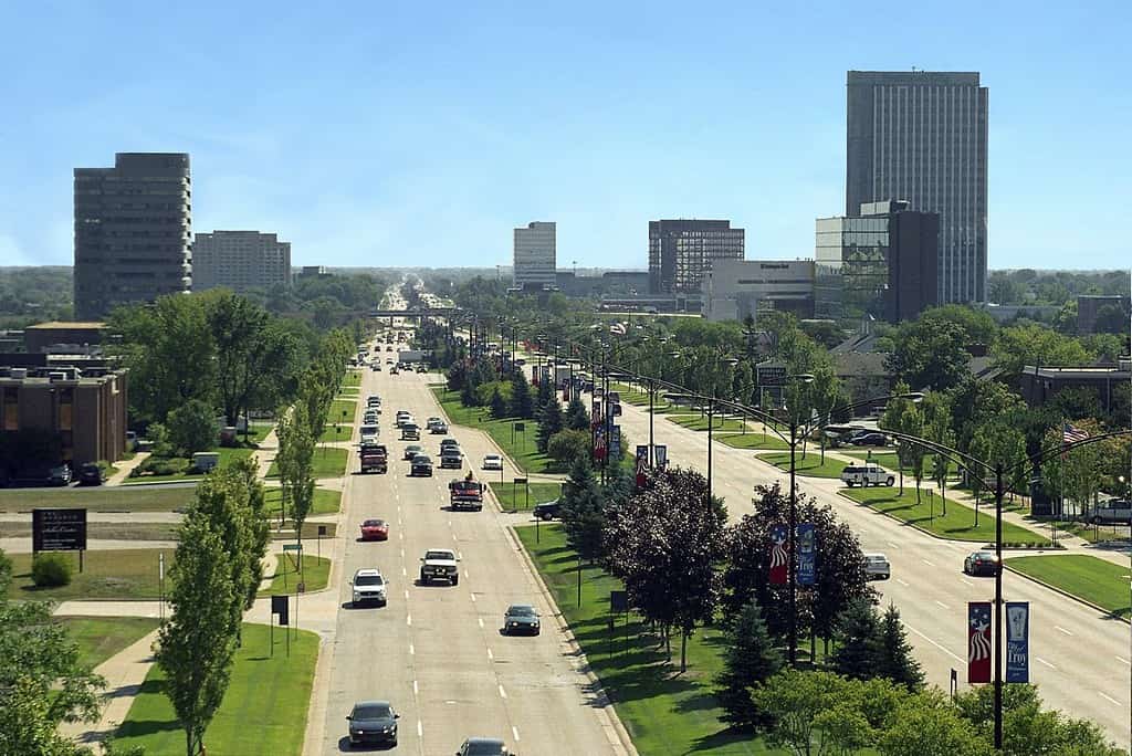 Troy Michigan as seen from above, view of the cars going down the road, the city in the background