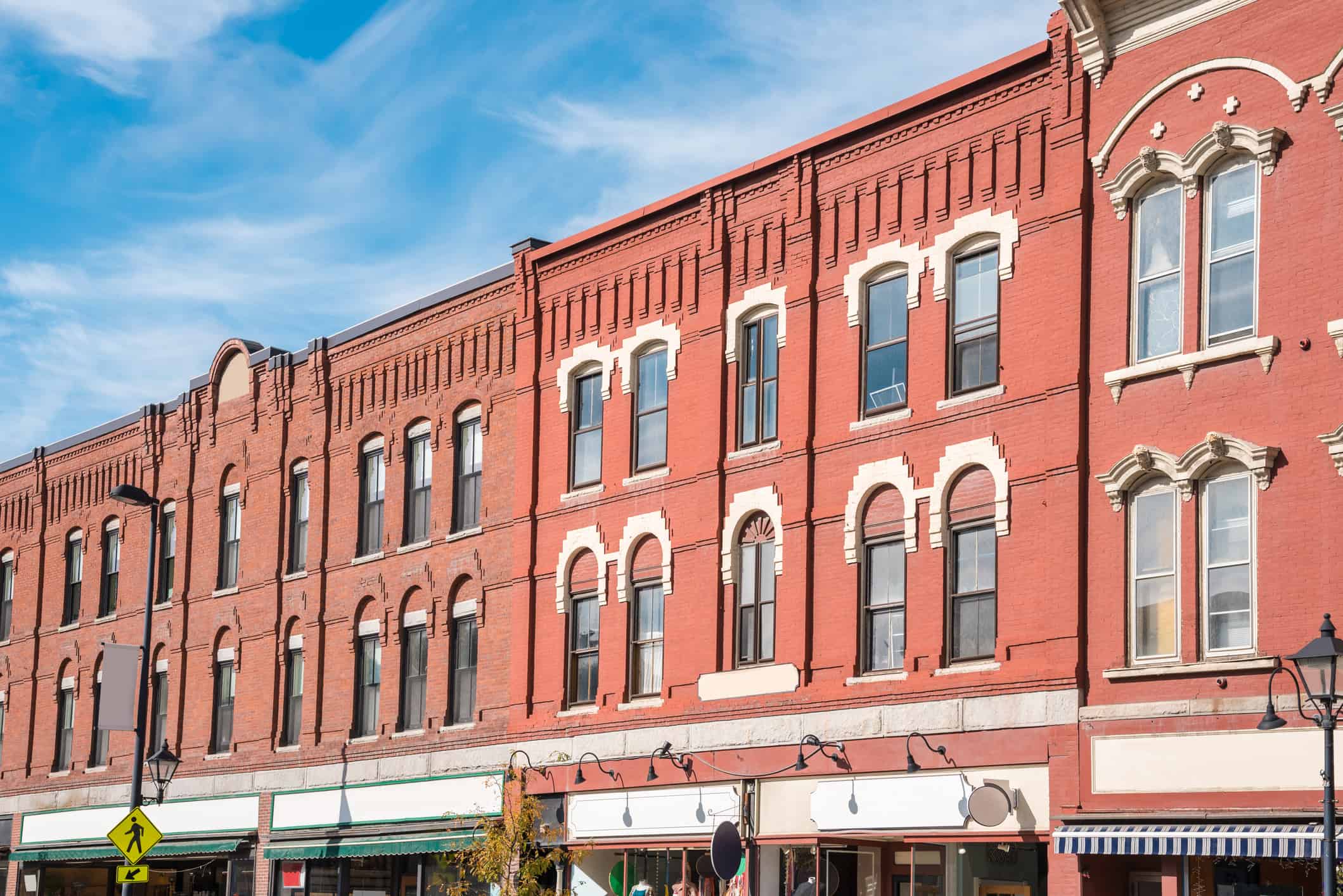 Row of traditional American brick buildings and blue sky