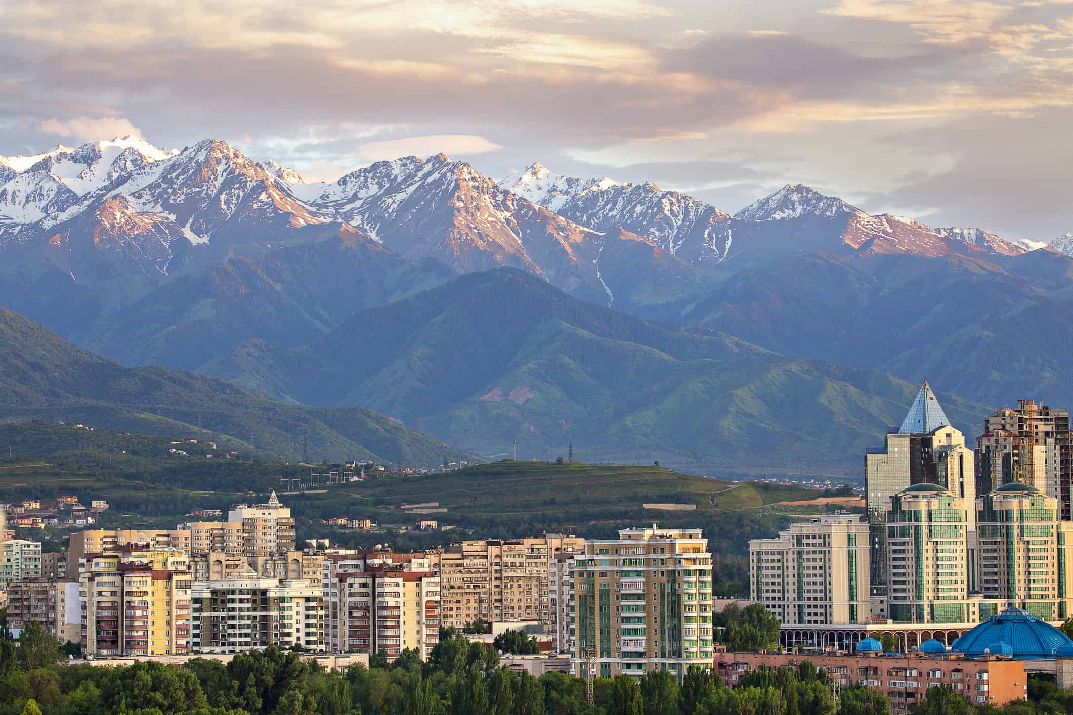 View over Almaty with snow capped mountains in the background, Almaty, Kazakhstan
