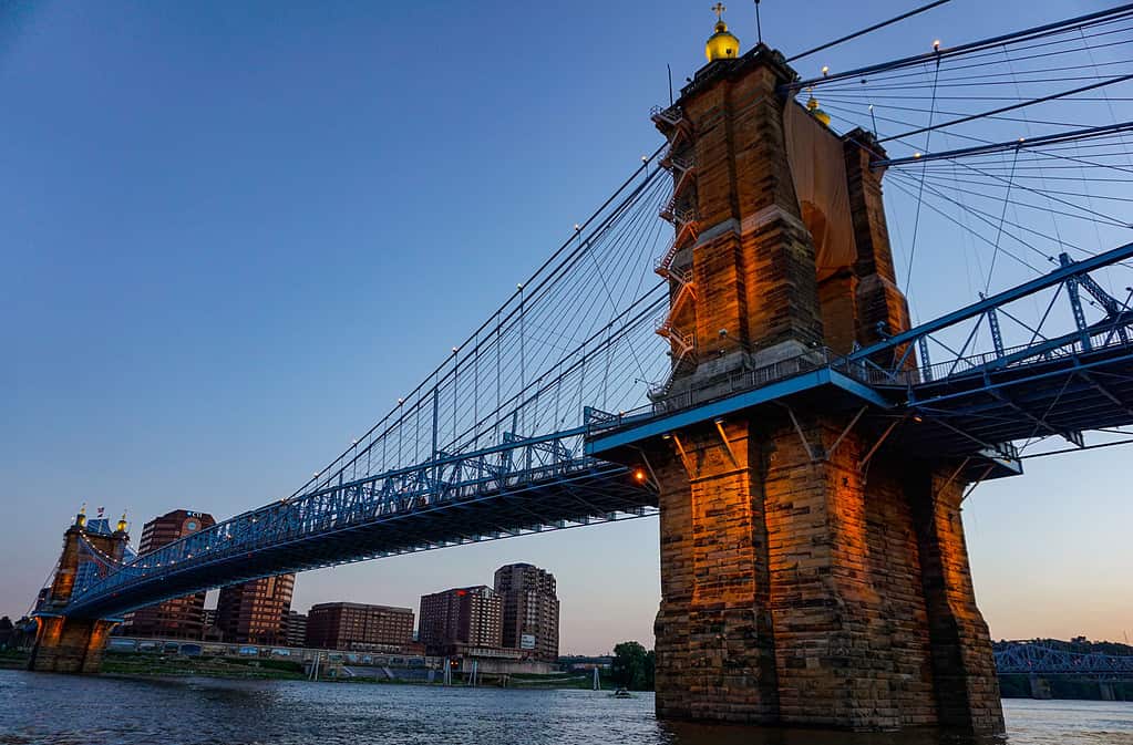 Beautiful view of the John A. Roebling Suspension Bridge at sunset in Covington, Kentucky.