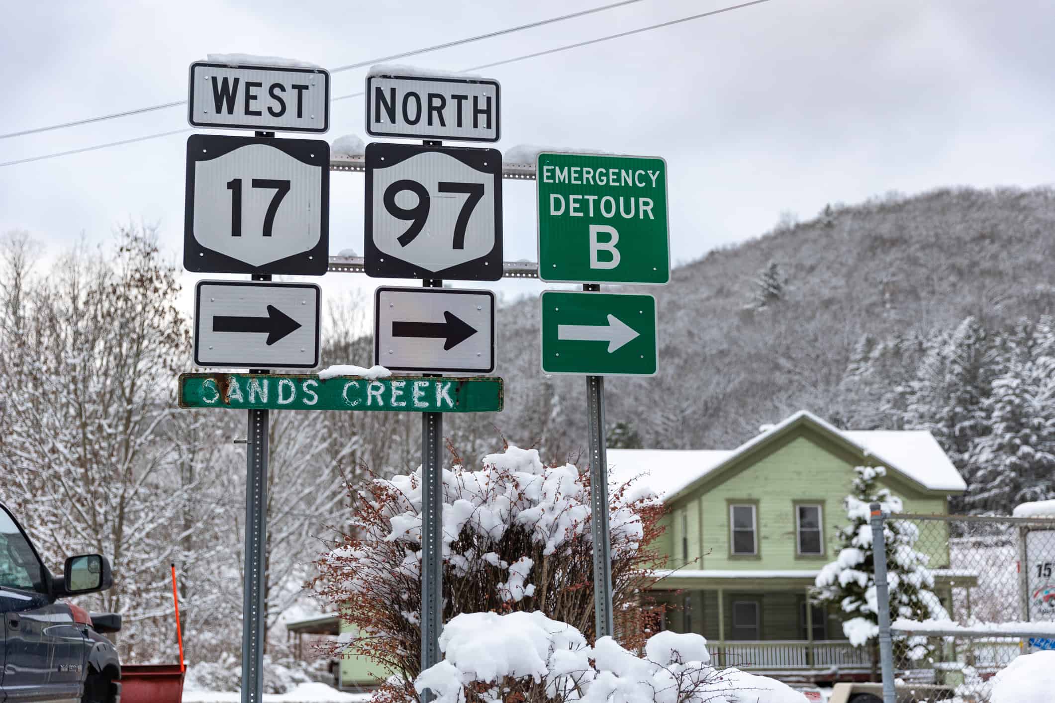 Road signage on a snowy afternoon in upstate New York. Route 17 and route 97 near Sands Creek