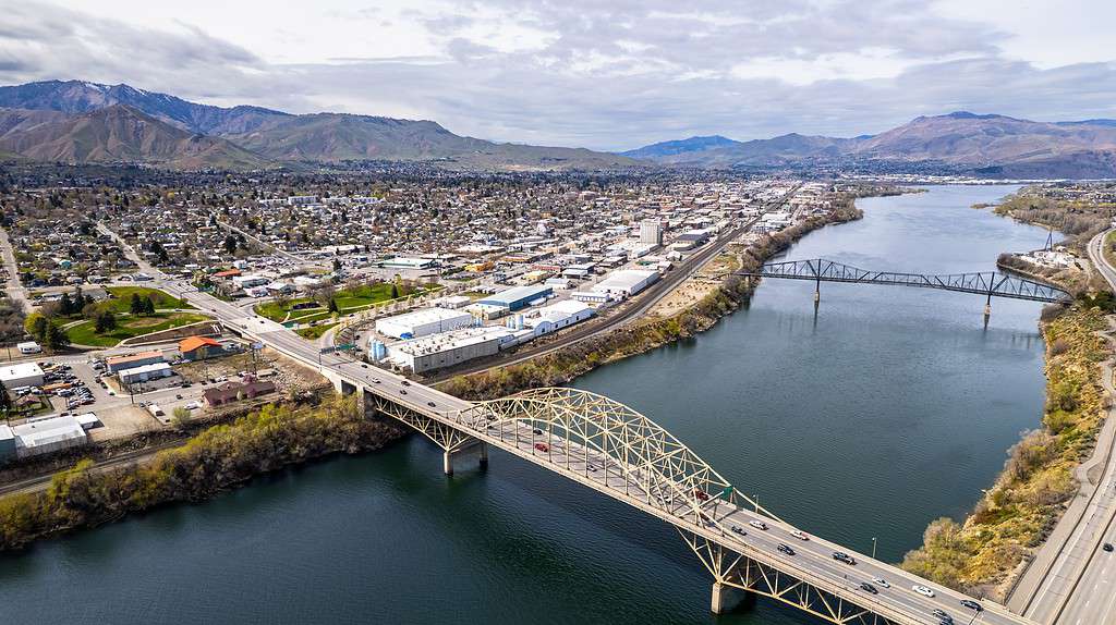 Aerial view of the Wenatchee Valley and nearby bright blue Columbia River on a bright day