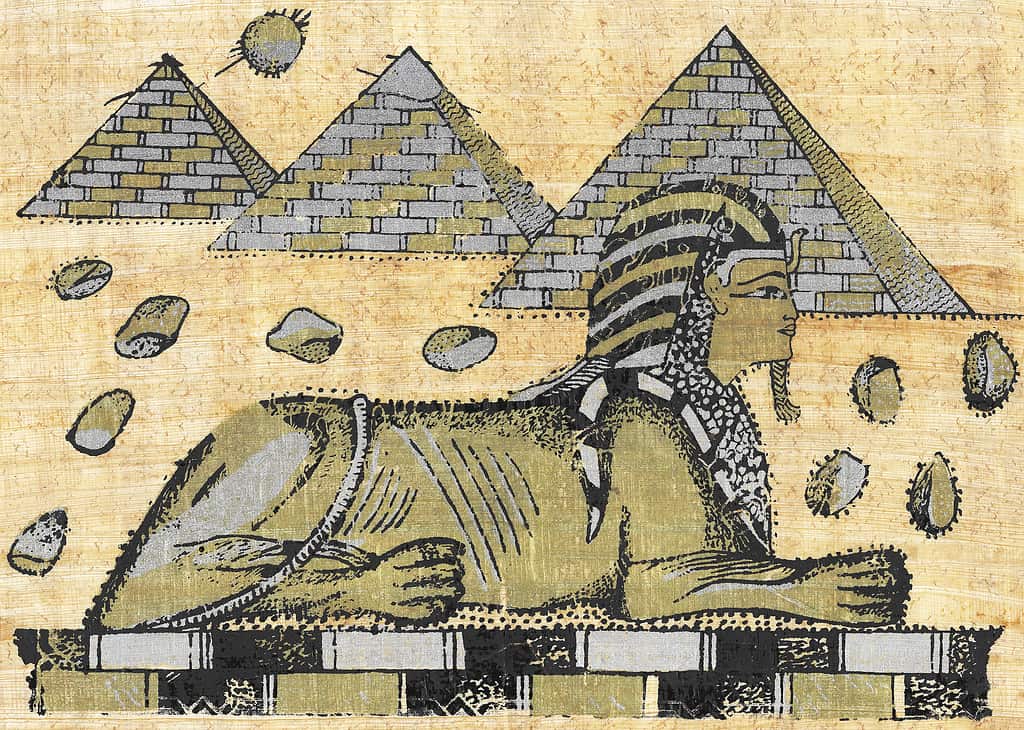 An Ancient Egyptian papyrus showing a sphinx and pyramids