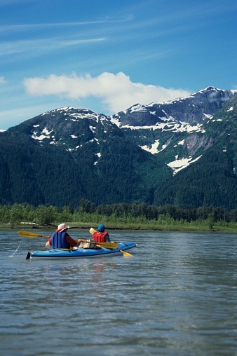 Two people kayaking on Stikine River, Stikine-LeConte Wilderness area, South East Alaska, USA