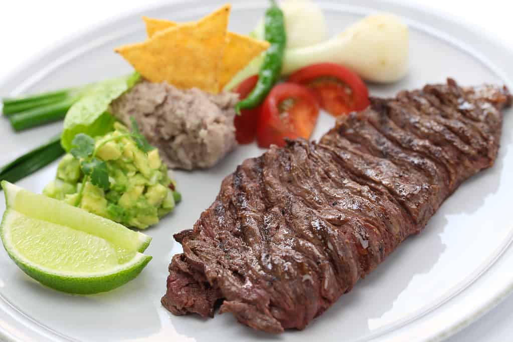 Well done skirt steak with Mexican side dishes