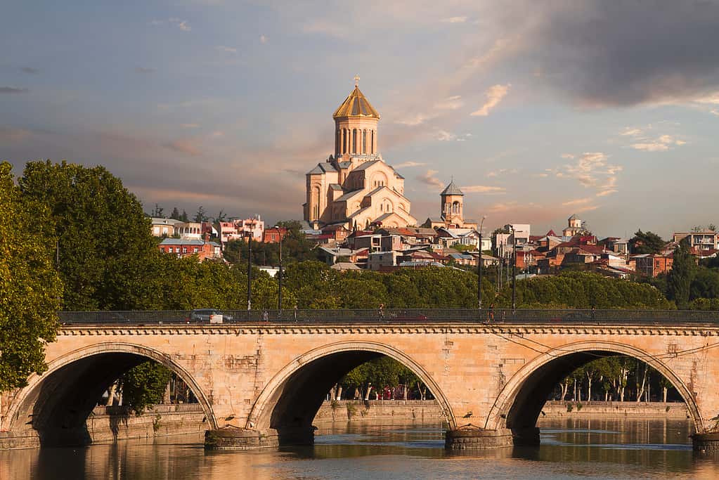 Saarbrucken bridge and Sameba Cathedral in Tbilisi, Georgia