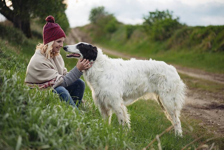Girl playing with her dog outdoor