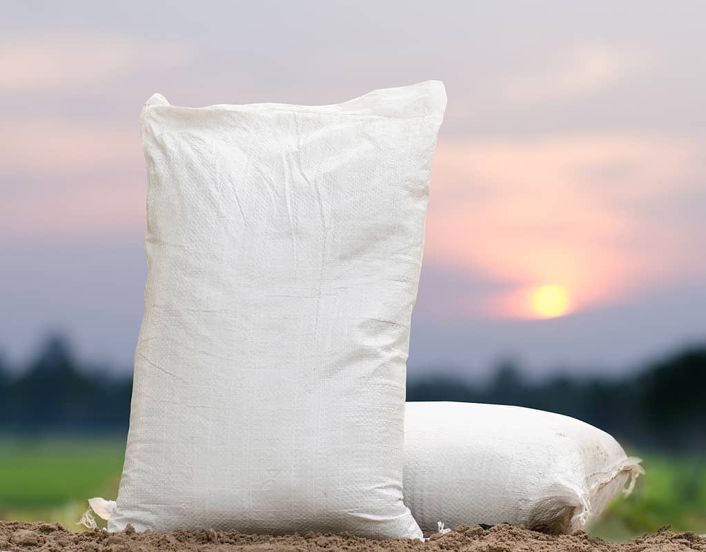 Fertilizer bag over sunrise