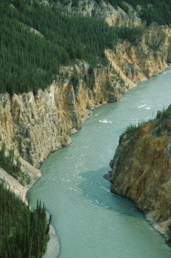 Nahnni River flowing between rocky cliffs, Canada