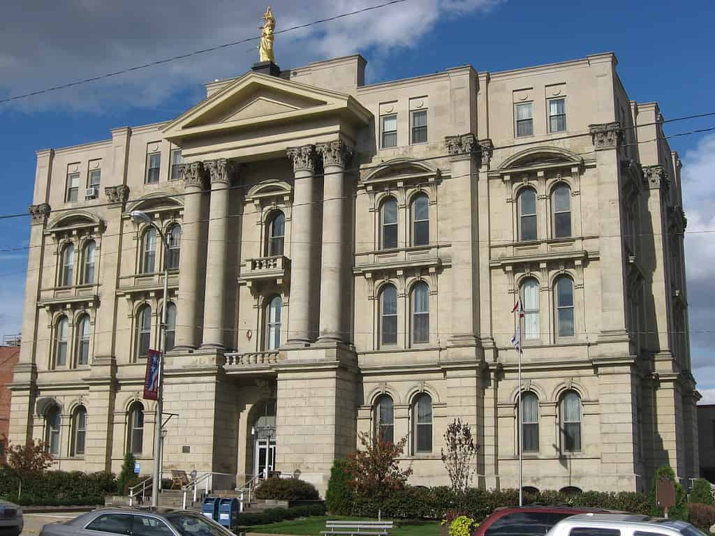 Front and eastern side of the Jefferson County Courthouse, located at 301 Market Street in Steubenville, Ohio, United States. Built in 1874, it is part of the Steubenville Commercial Historic District, a historic district that is listed on the National Register of Historic Places.