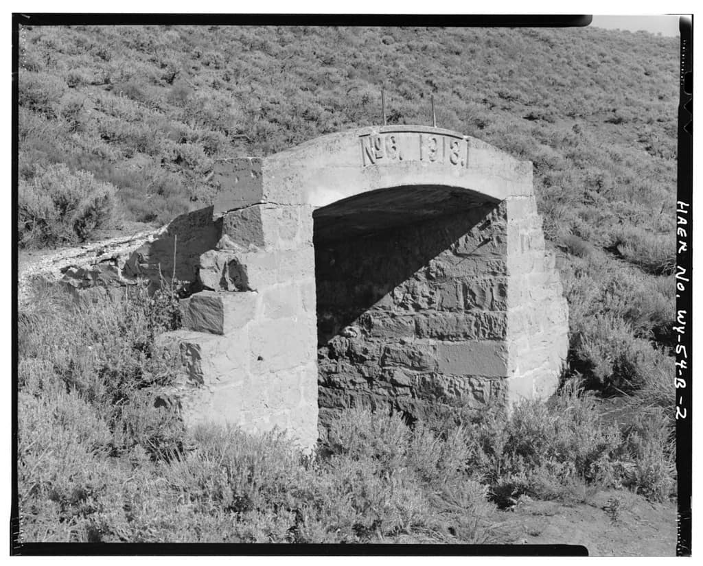 Old mine entrance near Kemmerer, Lincoln County, WY. Constructed of cut stone and concrete, with stair-stepped wings on each side, the portal entrance is an arch that bears the words "No. 6 1913."