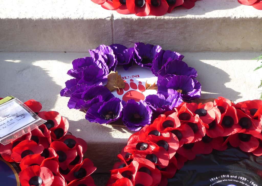 The purple poppy wreath to mark non-human animals involved in conflict, on the eastern side of the Cenotaph in Whitehall, London in 2018.