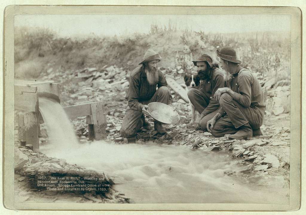 Image of gold rush prospectors washing and panning gold.