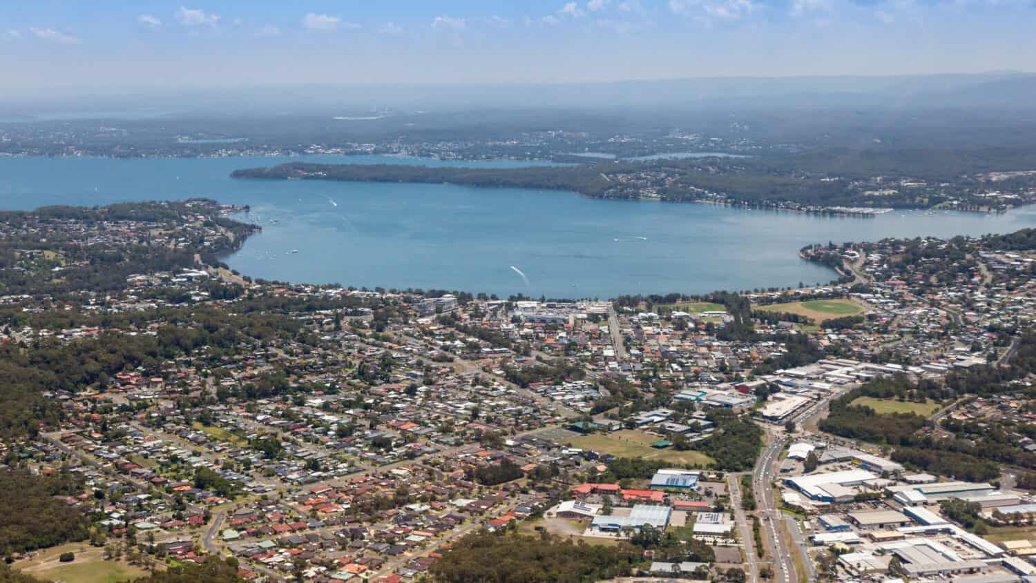 Aerial view of Lake Macquarie and Warners Bay - Newcastle Australia. The largest coastal lake in Australia is a popular area 25 minutes south of Newcastle CBD.