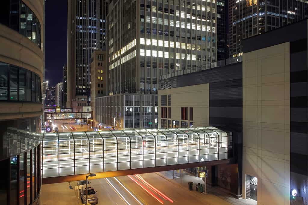 A High Angle Medium Shot on Downtown Minneapolis Skyscrapers and Skyway Walkways over Long Exposure Traffic during a Winter Night