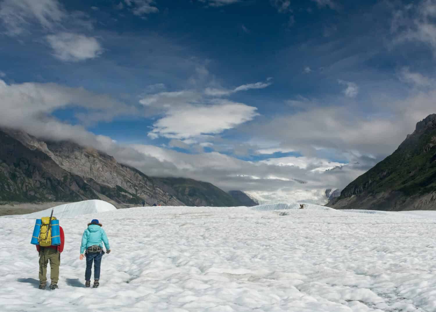 Two hikes walk across the top of Root Glacier in eastern Alaska.