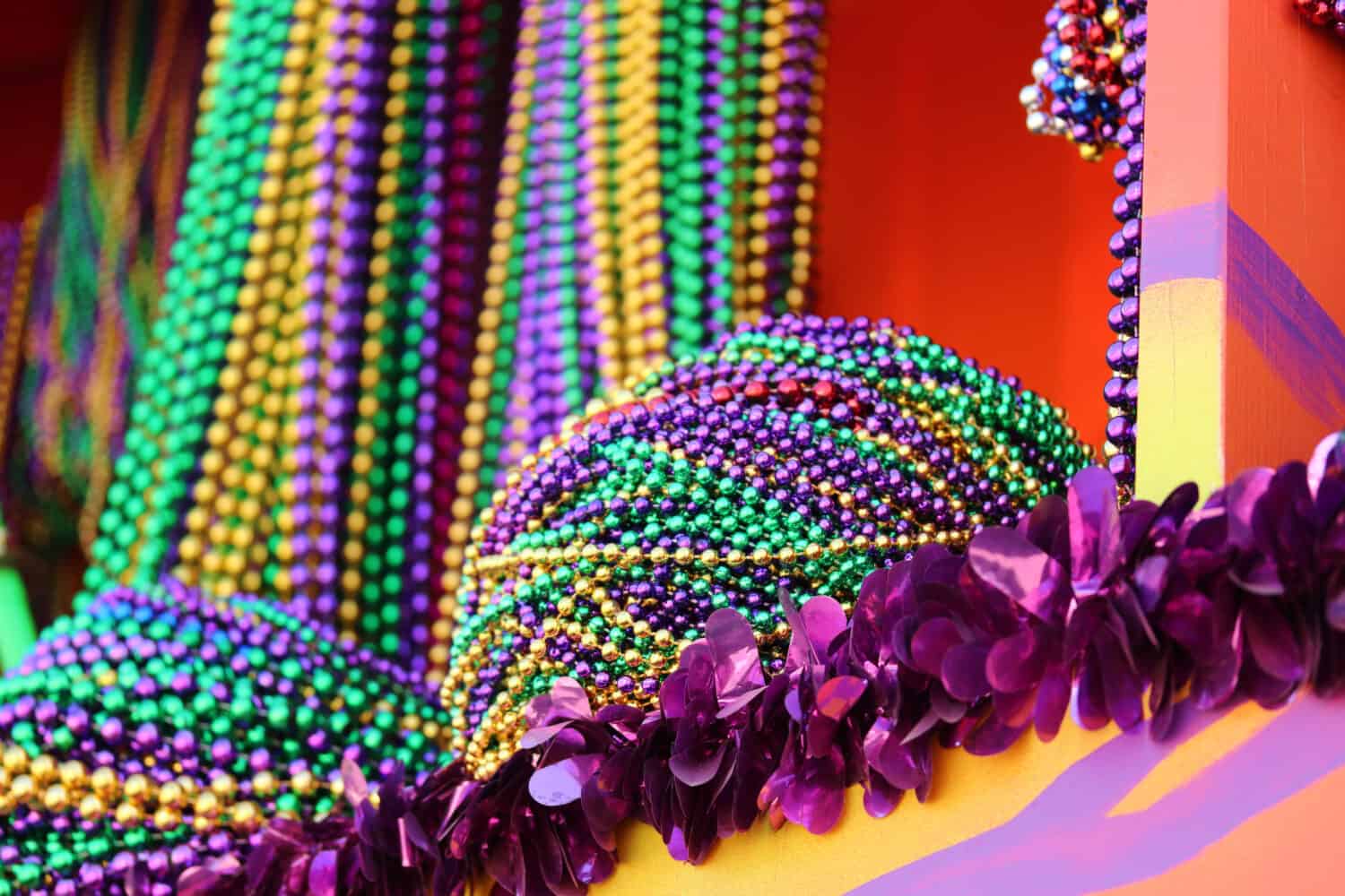 MARDI GRAS BEADS HANGING ON A FLOAT BEFORE A PARADE