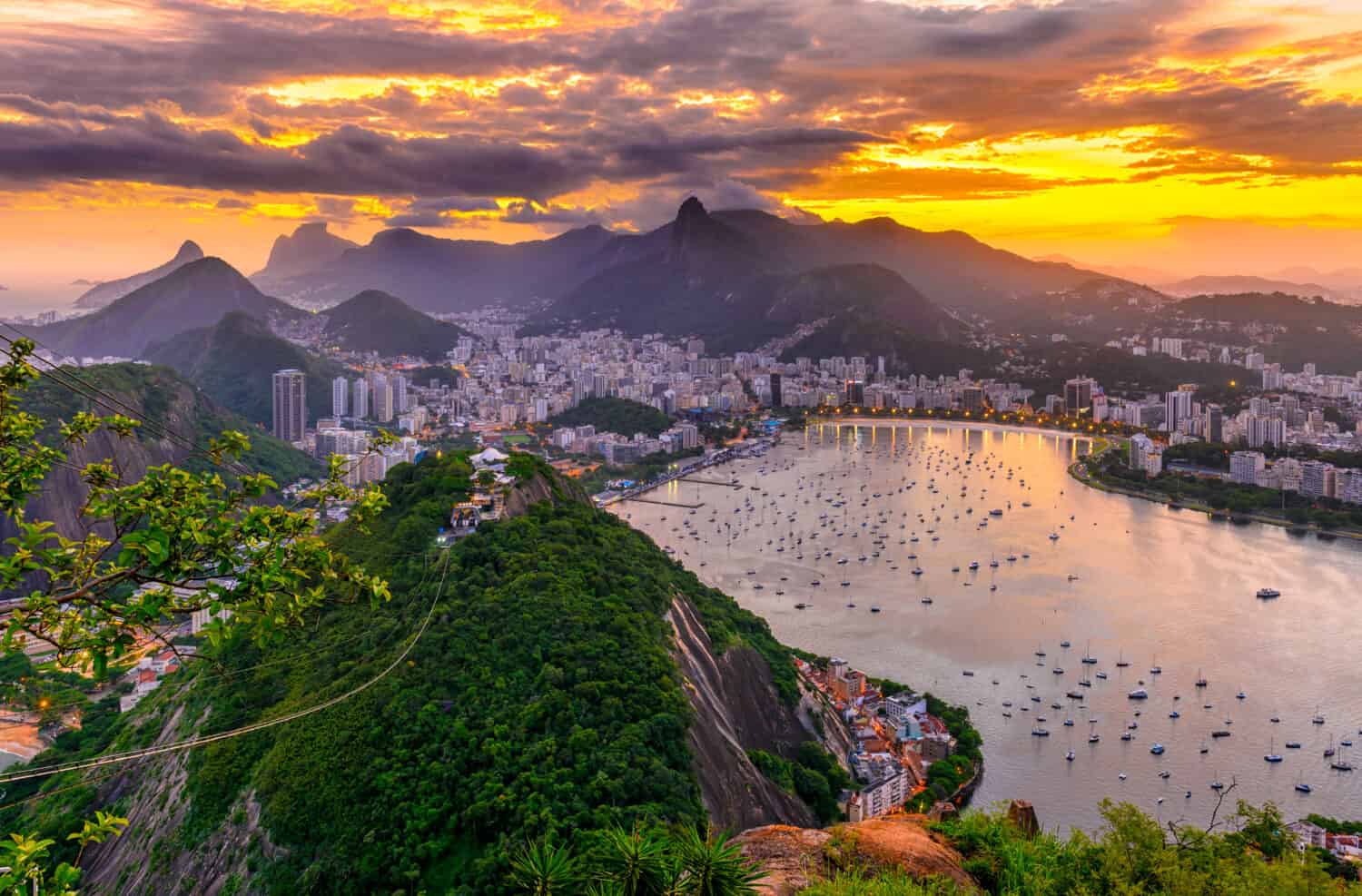 Sunset view of Corcovado, Botafogo and Guanabara bay in Rio de Janeiro, Brazil. Skyline of Rio de Janeiro. Sunset cityscape of Rio de Janeiro