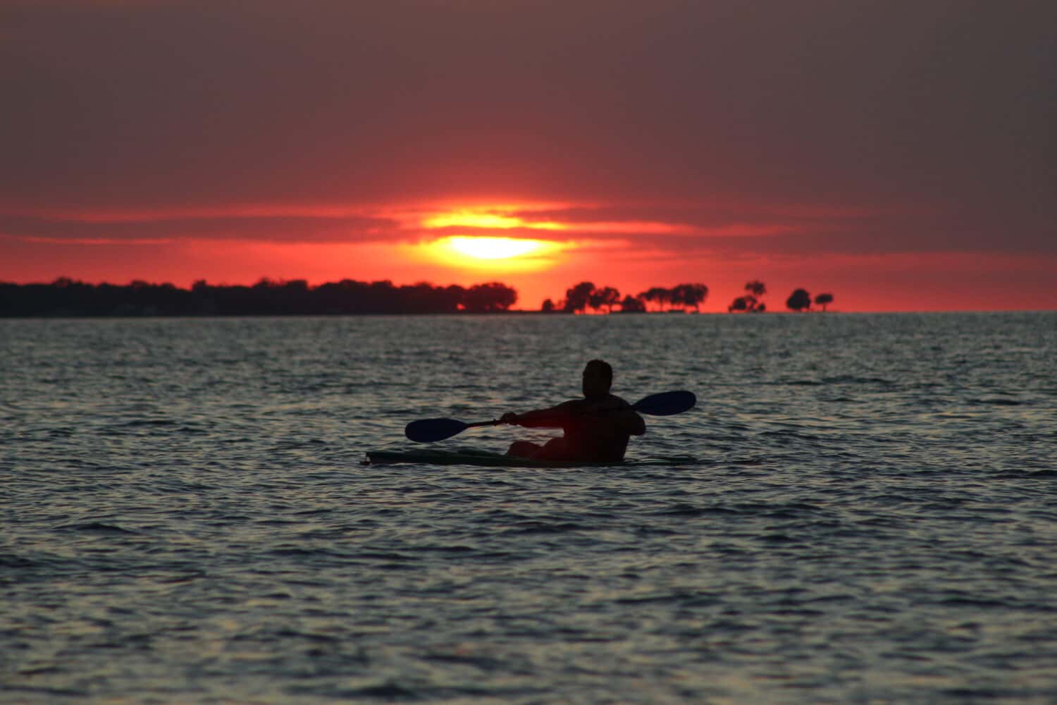 kayaking sunset silhouette