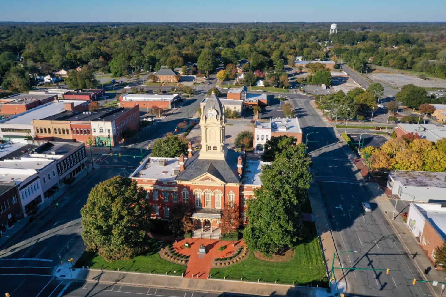 Aerial view of the old Court House in Monroe NC. Shot from the right side of the building with the sun shinning on the building.