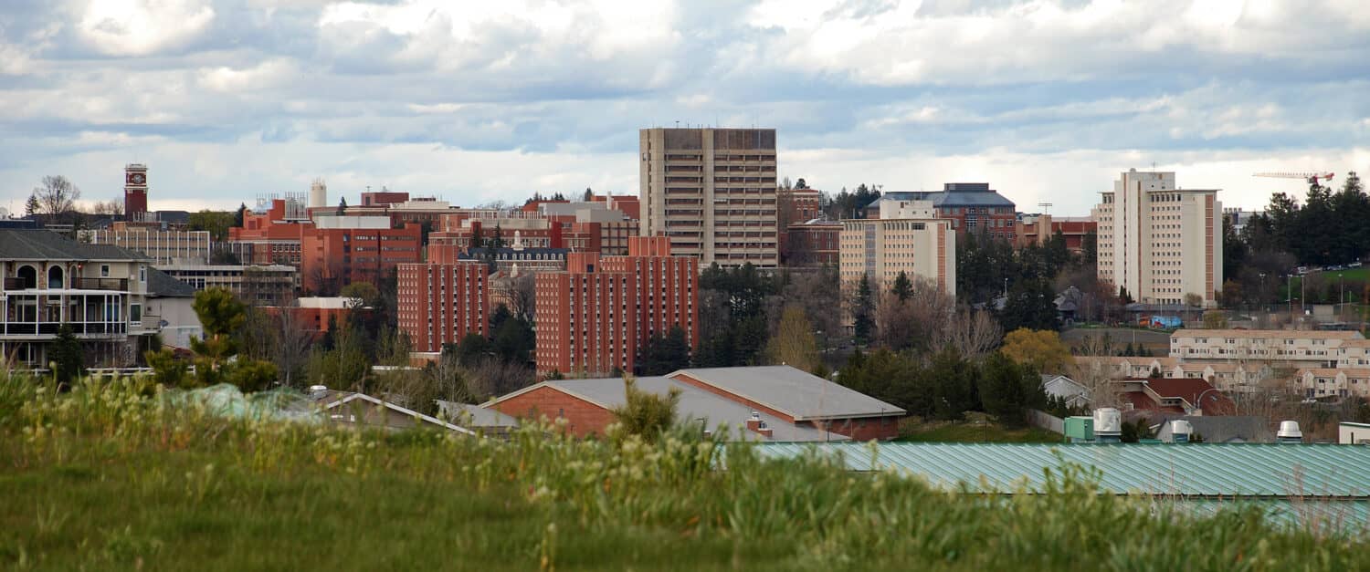 Panoramic skyline of Washington State University campus in Pullman, Washington.  WSU has a number of towering residence halls on the south side of the campus that make up a large student population.