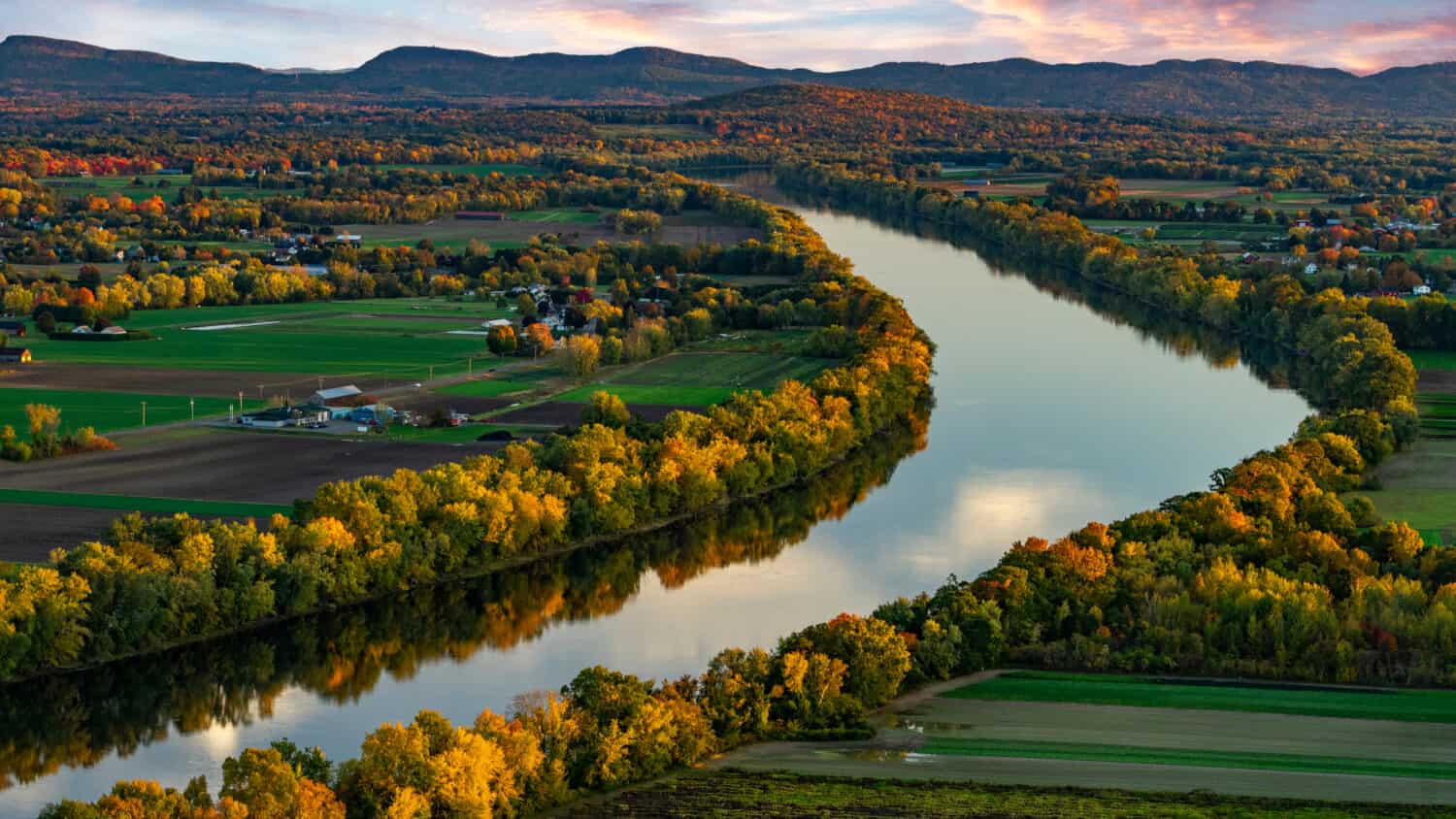 Pioneer Valley with the Connecticut River in Deerfield, Massachusetts at sunset- Northeast agriculture 