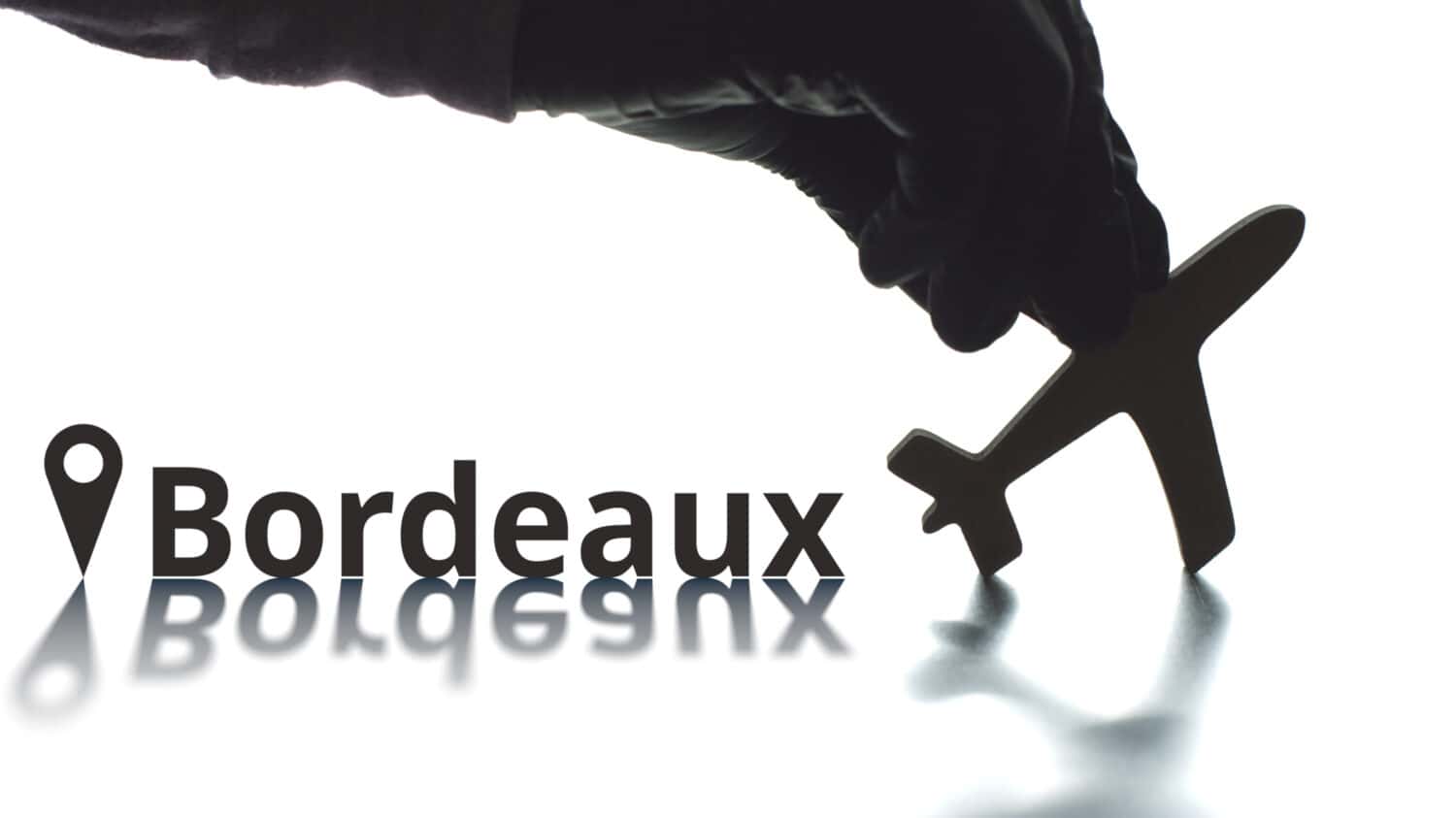 Bordeaux text, geotag and airplane silhouette, air transport concept