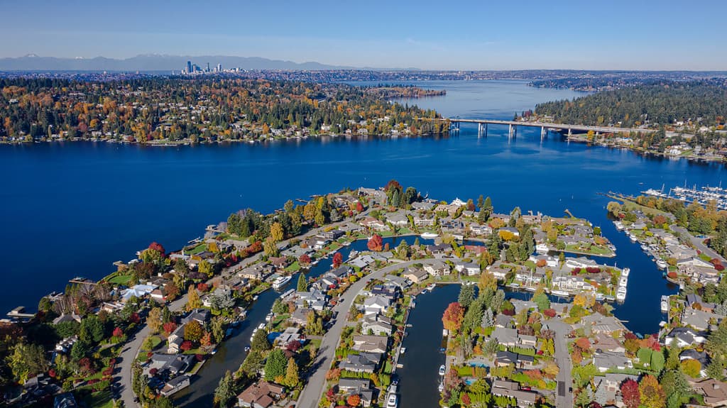 USA, Washington State, Bellevue. Newport Shores neighborhood, Lake Washington and floating bridge in autumn, with Seattle in distance.