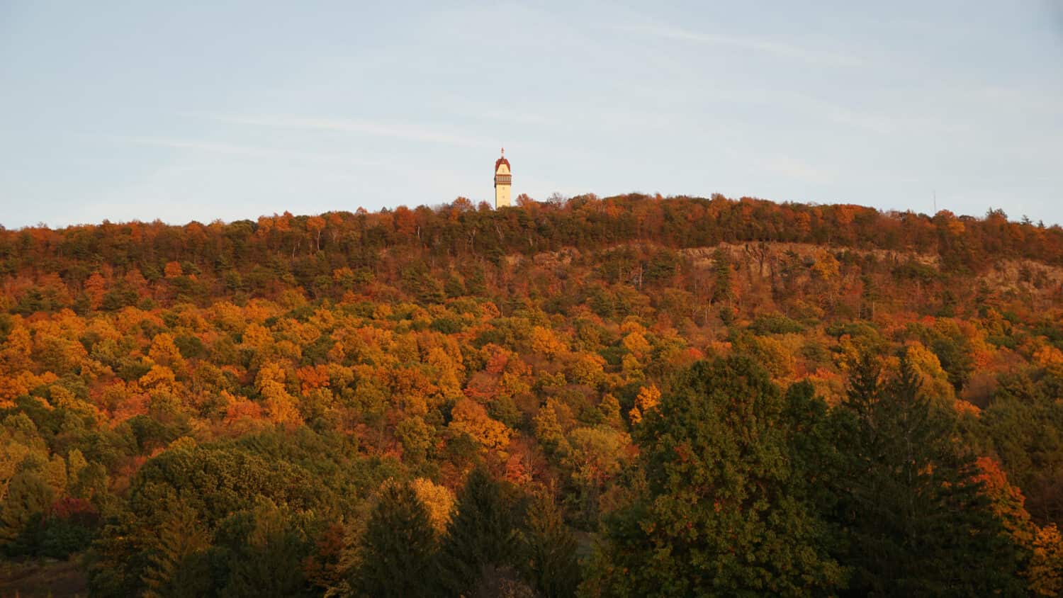A view of Heublein Tower during Autumn on Talcott Mountain in Simsbury Connecticut.  Colorful leaves.