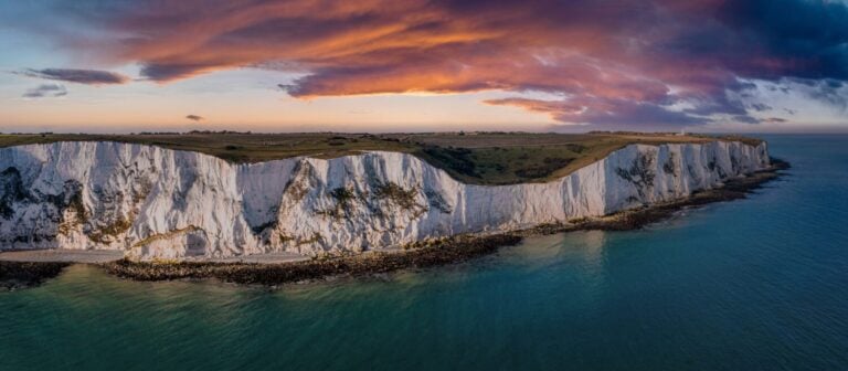 Aerial view of the White Cliffs of Dover. Close up view of the cliffs from the sea side. England, East Sussex. Between France and UK