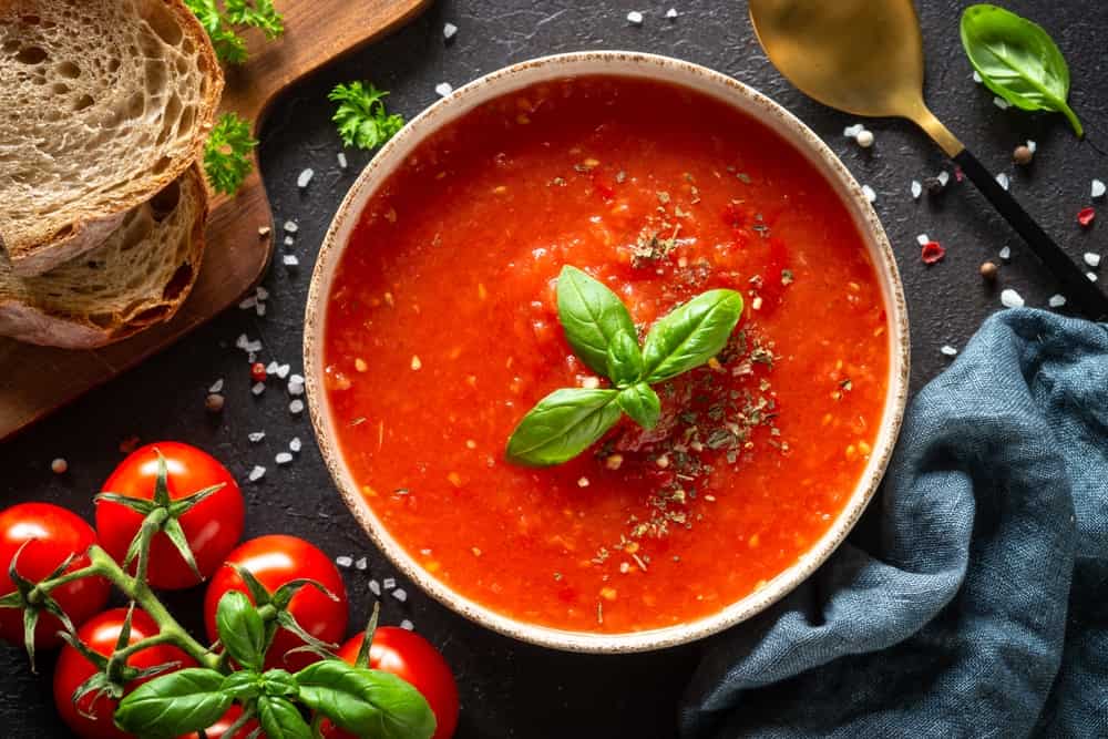 Tomato soup, vegan dish on white.