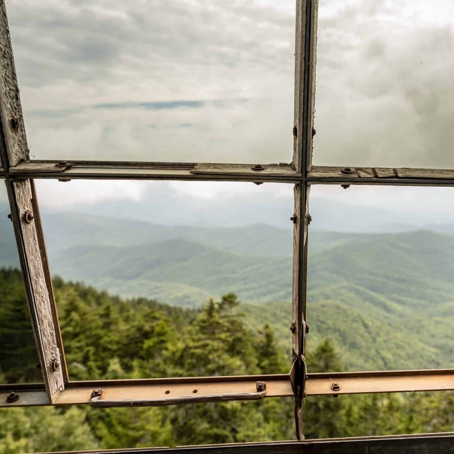 Looking out the Glass Windows of Mount Sterling Fire Tower in Great Smoky Mountains National Park