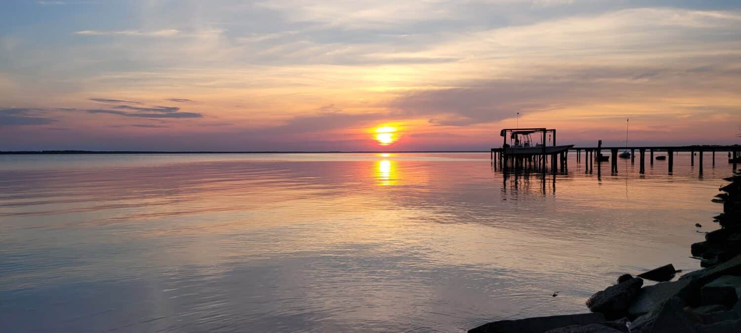 Beautiful summer sunset with a pier on the Albemarle Sound in NC on our annual vacation