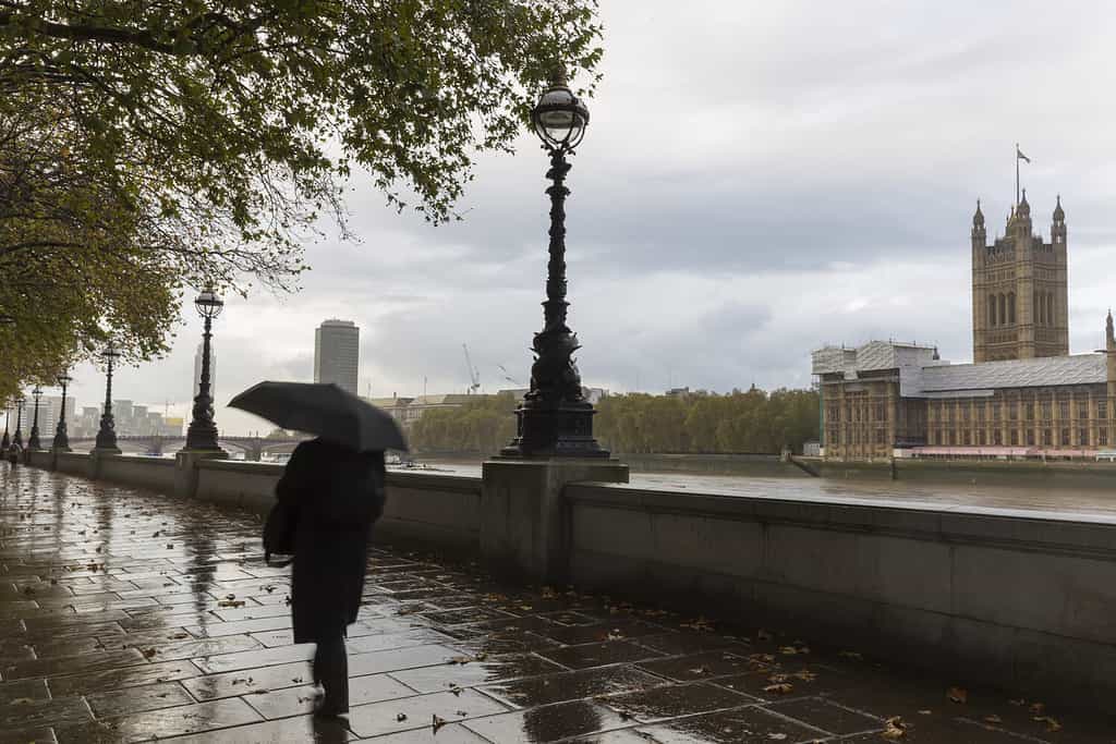 A rainy day on the South Bank of River Thames with Palace of Westminster in Background, London, England, UK