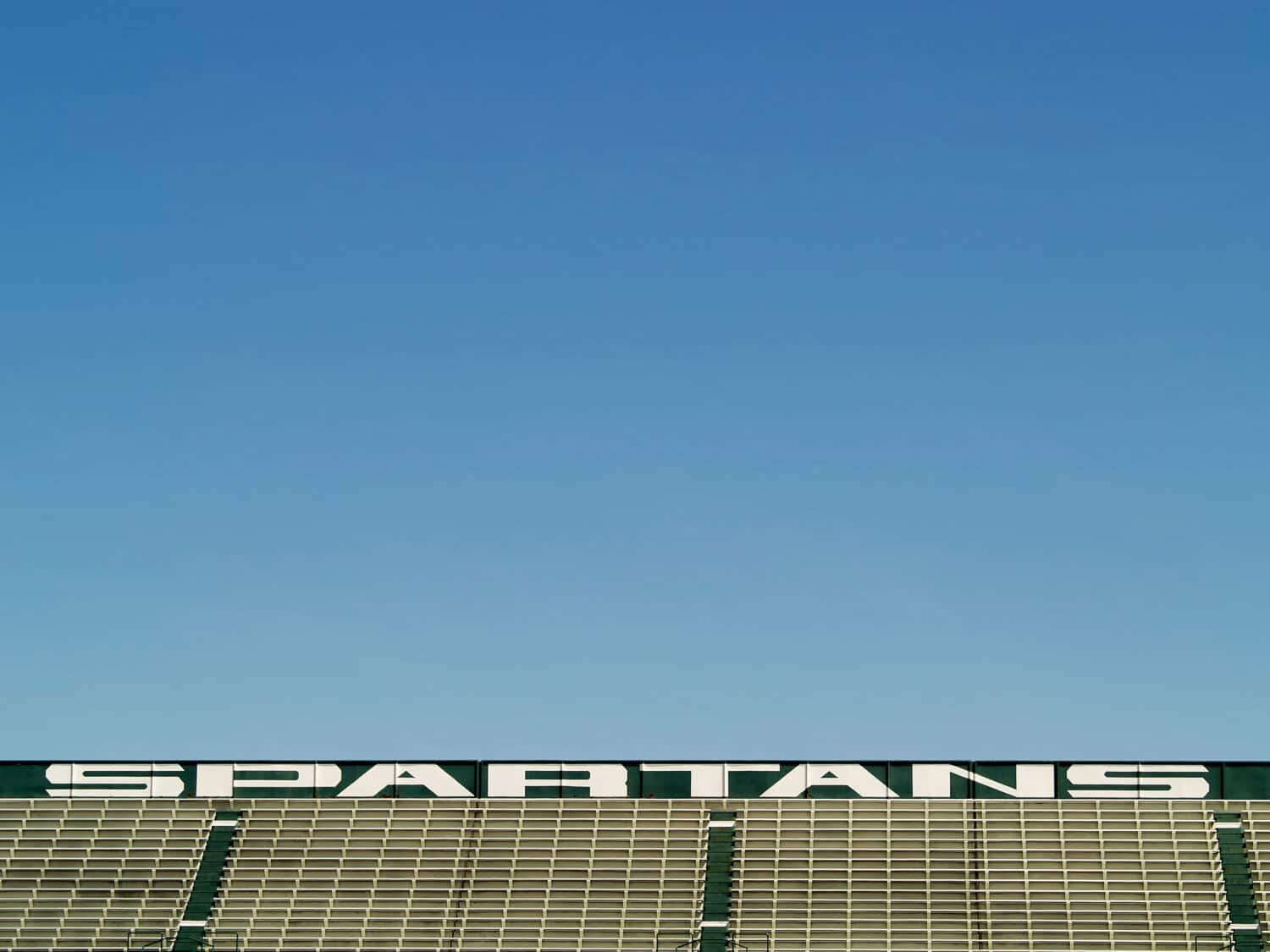 empty bleachers in Spartans sports stadium
