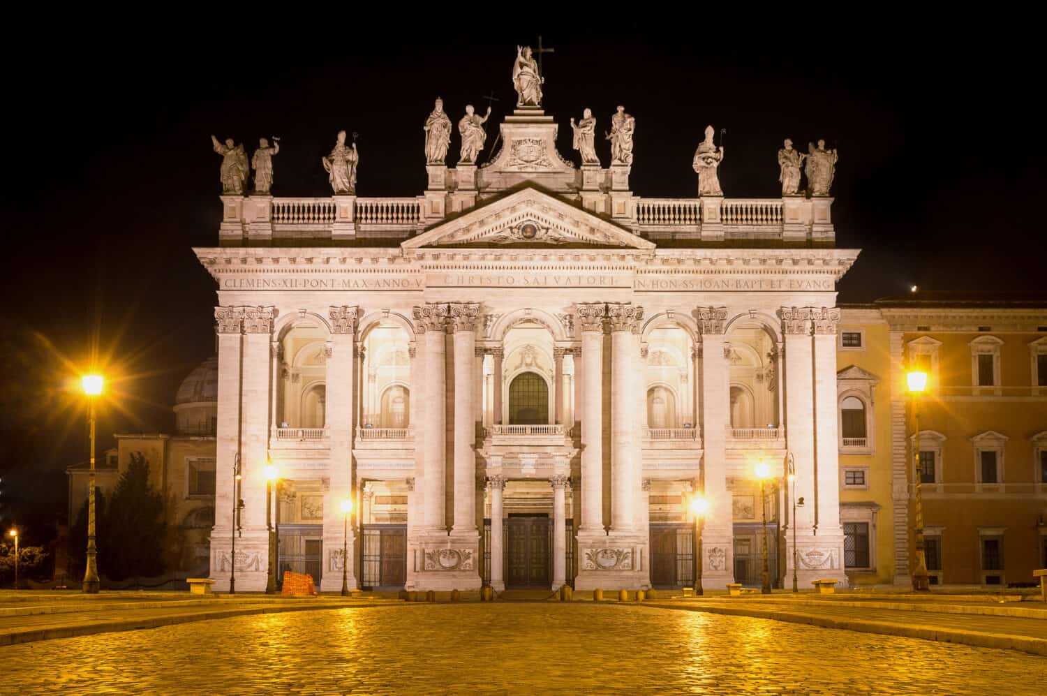 The papal archbasilica (or basilica) of St John in the Lateran, in Rome,, Italy, lit in the dark night. This is the main church or basilica of Cathoiic world, the bishop's seat of the Pope.
