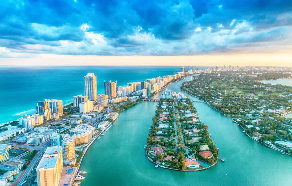 Miami Beach, wonderful aerial view of buildings, river and vegetation. The city could be underwater by 2050.