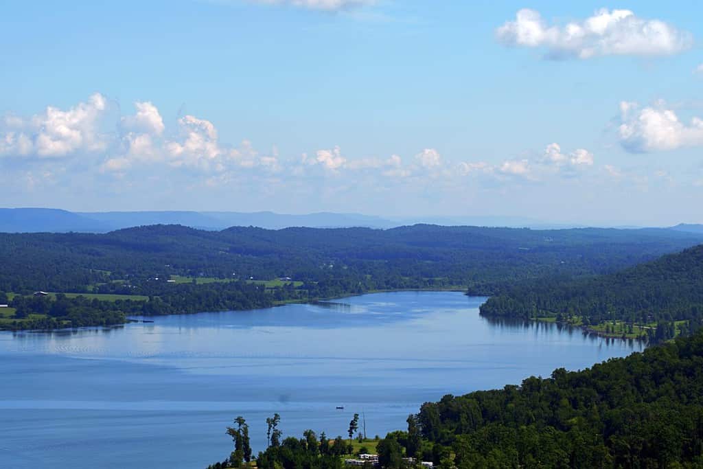 High scenic vista of Lake Guntersville State Park with blue skies and fluffy clouds