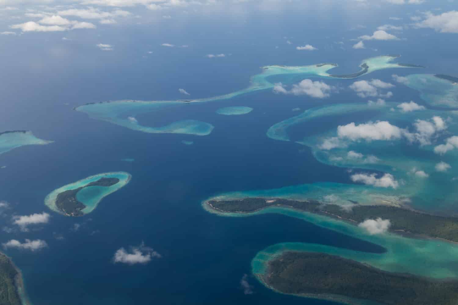 Aerial view photograph of small islands in the Solomon Islands.