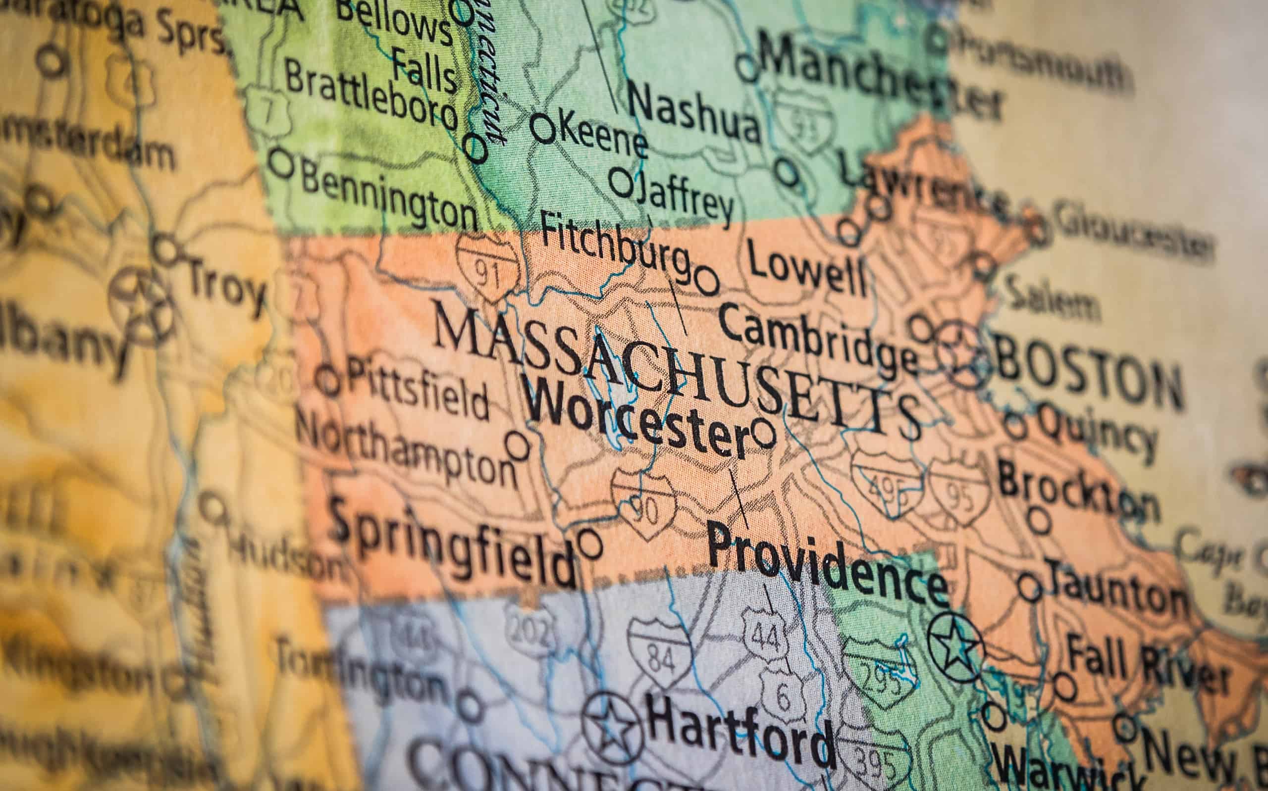 Closeup Selective Focus Of Massachusetts State On A Geographical And Political State Map Of The USA.