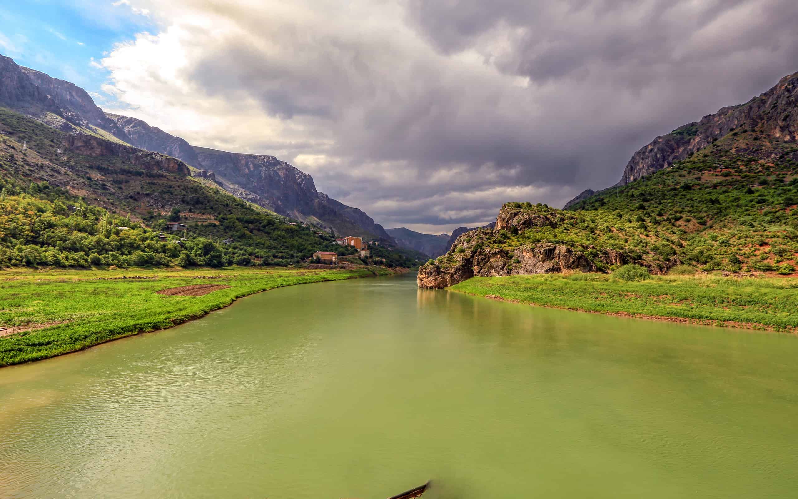 Landscape of the Euphrates River in Kemaliye, Erzincan, Turkey. The Euphrates flows through Syria and Iraq to join the Tigris in the Shatt al-Arab, which empties into the Persian Gulf.
