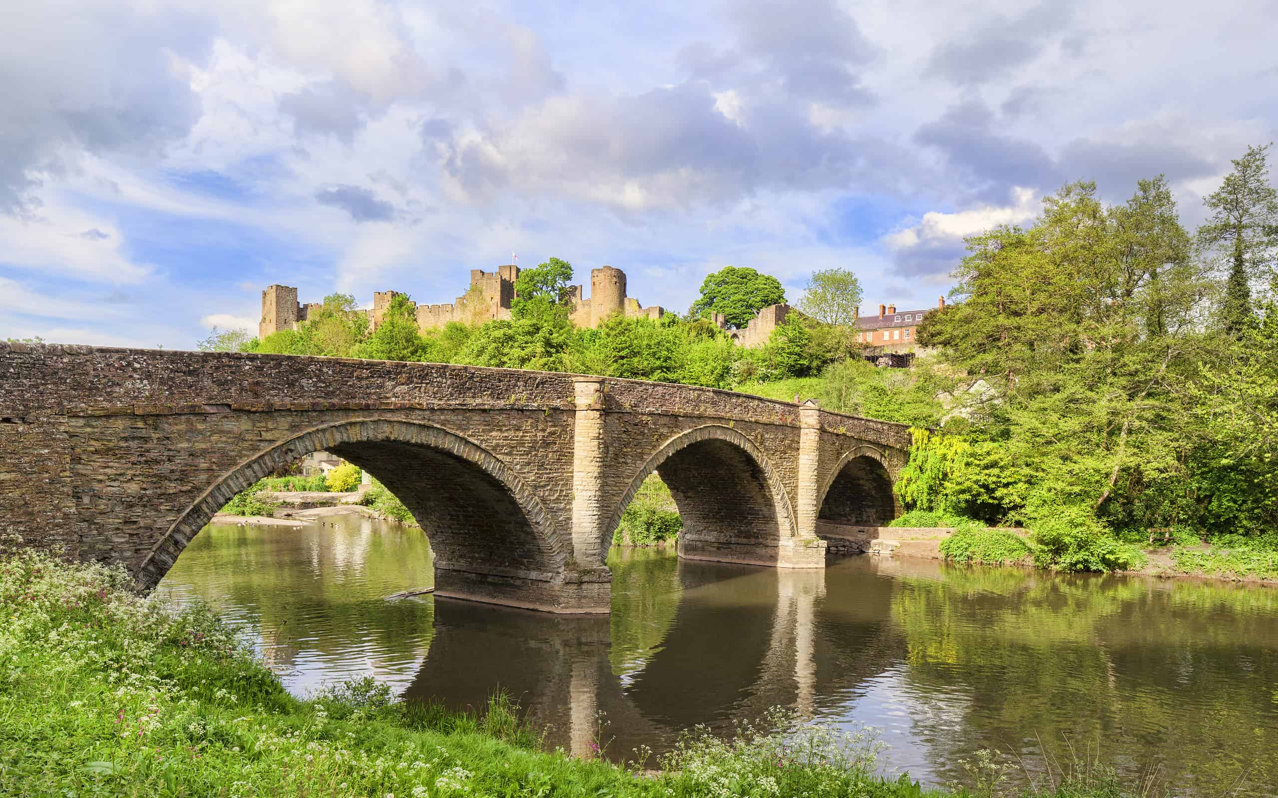 Dinham Bridge, the River Teme and Ludlow Castle ruins, Shropshire, England, UK