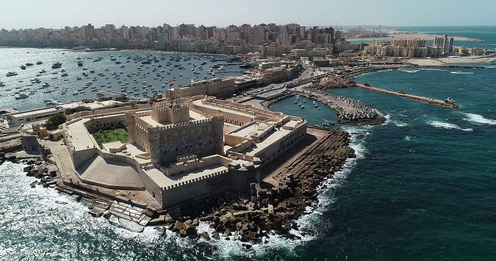 Aerial Drone shot over Egypt Alexandria City sea - The Citadel of Qaitbay