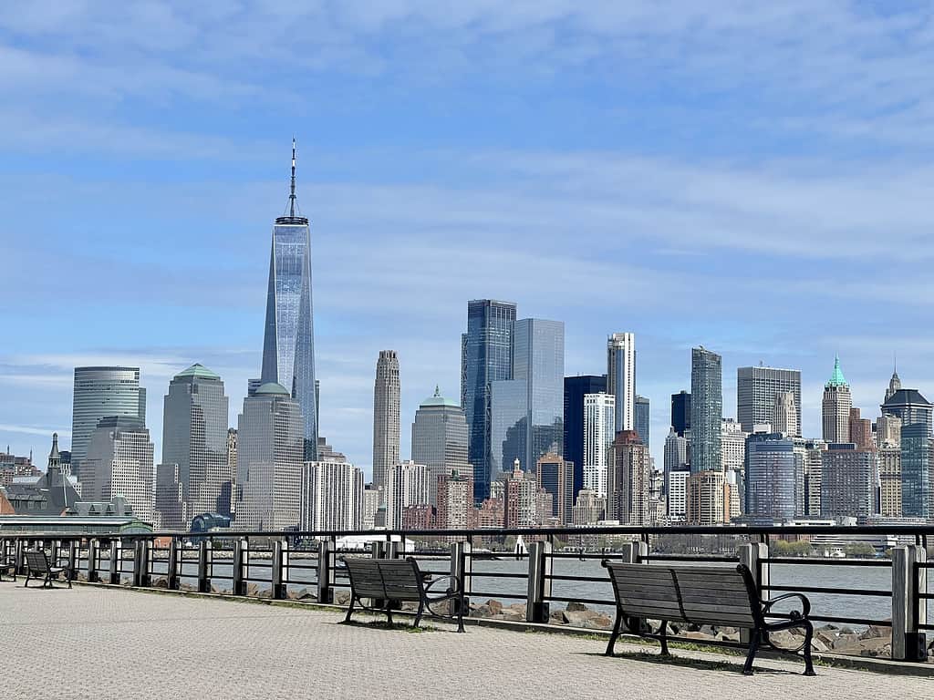 New York City skyline viewed from Liberty Park with benches in foreground