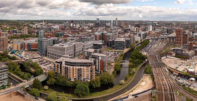 Aerial cityscape view of Leeds city centre and train station