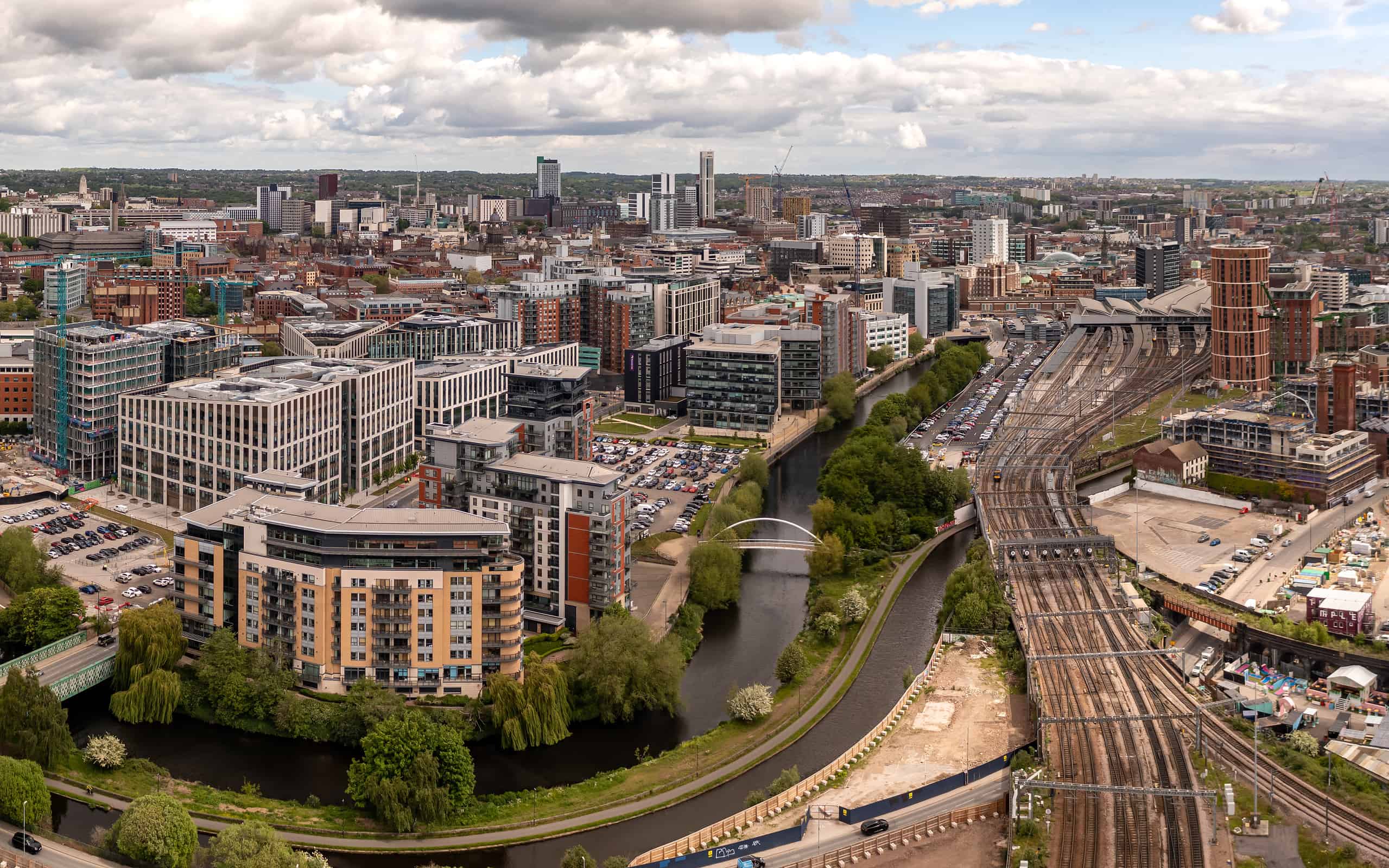 Aerial cityscape view of Leeds city centre and train station